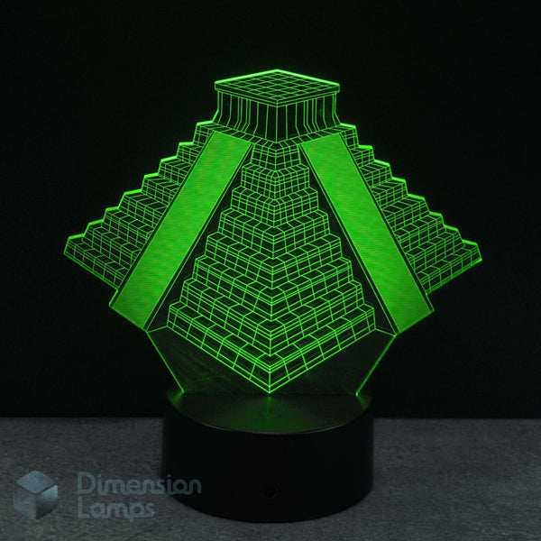 3D pyramid-shaped lamp with green light on a black background. Ancient history biff gift idea. 