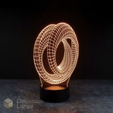 Mobius strip 3d night lamps: yellow illumination of a continuous looped geometric design on a lamp, rising from a base against a dark background. Marvel Avengers Endgame movie.