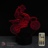 Motorcycle-themed night light with remote control on a dark background