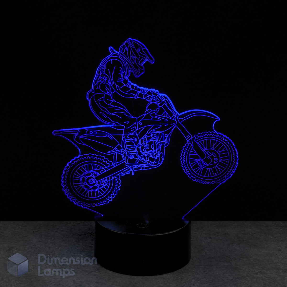 3D LED lamp of a motocross rider on a bike with blue light on a black Gift idea for dirt bike riders background.
