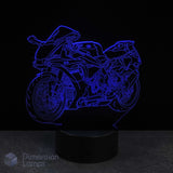 Motorcycle-shaped night light emitting a blue glow on a black background. Gift idea for supersport Motorbike fans.