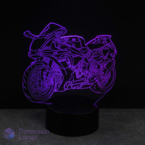 Motorcycle-shaped lamp emitting a purple glow on a dark background. Gift idea for supersport and Sports Bike fans.