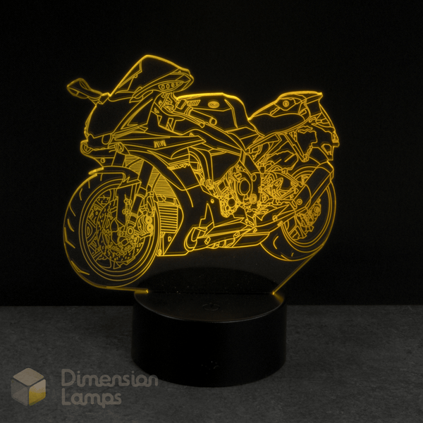 Motorcycle-shaped night light with yellow outline on a black background. Gift idea for Supersport and Sports Bike fans.