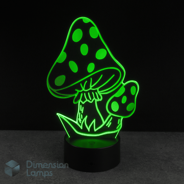 Mushroom-shaped LED lamp with green polka dot design on a black background