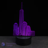 Purple One World Trade Center cityscape lamp on a black base with 'Dimension Lamps' branding.