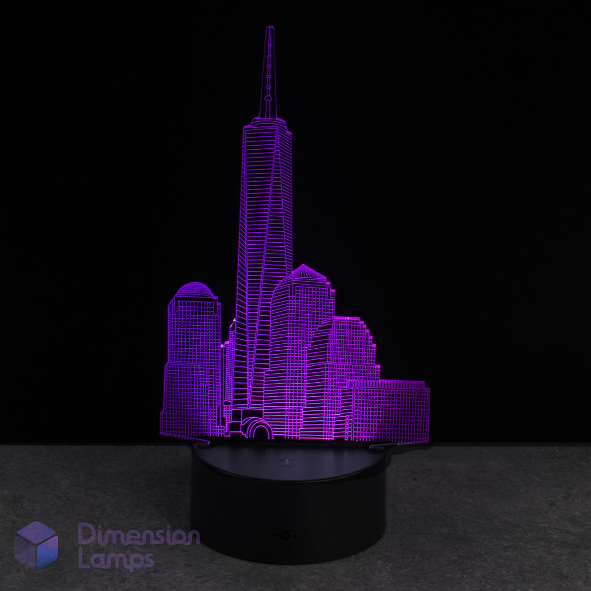 Purple One World Trade Center cityscape lamp on a black base with 'Dimension Lamps' branding.