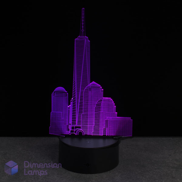 Purple One World Trade Center cityscape lamp on a black base with 'Dimension Lamps' branding.