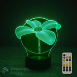 3D daisy lily flower lamp with 7 colour remote control with sleep timer buttons on a dark background. Ornamental flower gift idea for flower fans.