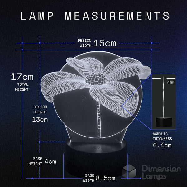 A dimension diagram for a flower-shaped acrylic lamp on a black base, showing measurements including design width 15cm, total height 17cm, design height 13cm, base height 4cm, and base width 8.5cm on a dark blue background.