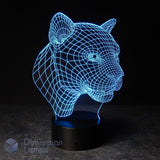 A 3D optical illusion LED lamp shaped like a panther head, glowing with a blue wireframe effect on a black base. The Aussie brand 'Dimension Lamps' is faintly visible in the bottom-left corner. Big cat gift idea. 