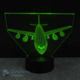 3D Boeing 747 airplane-shaped LED lamp glowing green on a dark background.