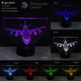 Boeing 747 Airplane LED lamp displaying various colours on a dark background.