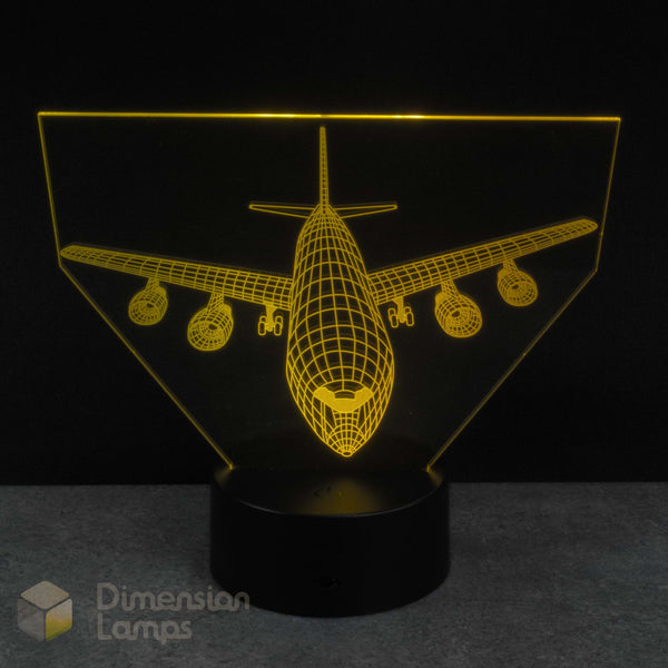 3D airplane-shaped lamp with a black base on a dark background. Airplane gift for kids.
