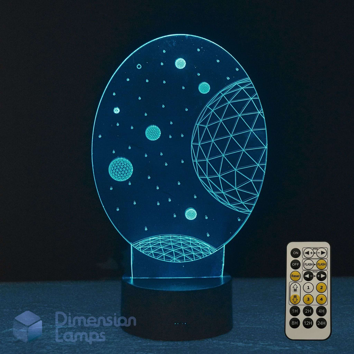 A 3D optical illusion night light shaped like a celestial space scene, glowing with a blue light on a black base, shown with its remote control against a dark background.