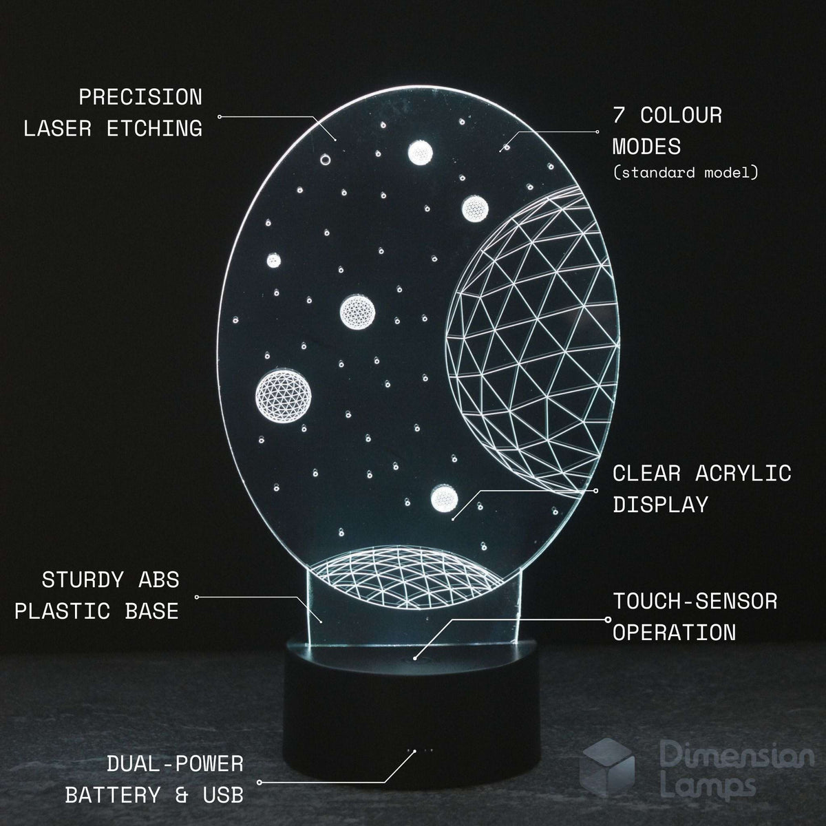 An illuminated 3D acrylic night light with a black base, featuring a celestial design of stars and planets. The image includes text callouts explaining features like 'PRECISION LASER ETCHING', '7 COLOUR MODES', 'CLEAR ACRYLIC DISPLAY', 'STURDY ABS PLASTIC BASE', 'TOUCH-SENSOR OPERATION', and 'DUAL-POWER BATTERY & USB'.
