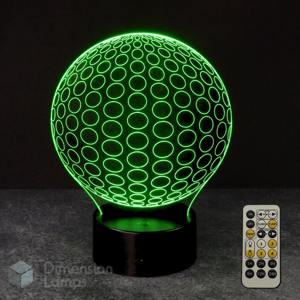 Green spherical lamp with a remote control on a dark background