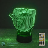 A 3D optical illusion rose night light glowing green, shown with a 7 colour sleep timer remote control on a dark surface against a black background. The brand name 'Dimension Lamp' is visible as a watermark in the bottom-left corner.