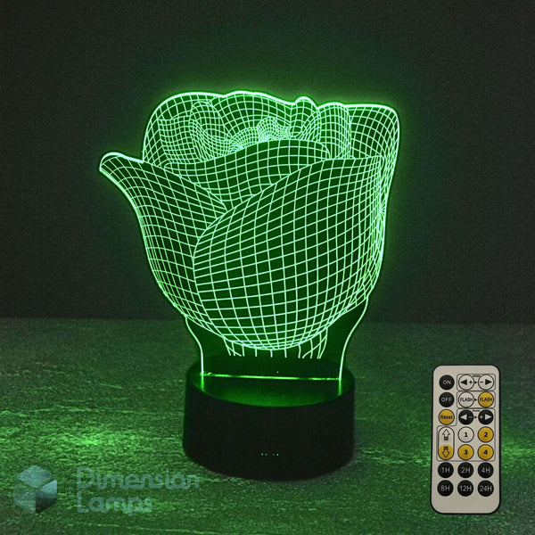 A 3D optical illusion rose night light glowing green, shown with a 7 colour sleep timer remote control on a dark surface against a black background. The brand name 'Dimension Lamp' is visible as a watermark in the bottom-left corner.