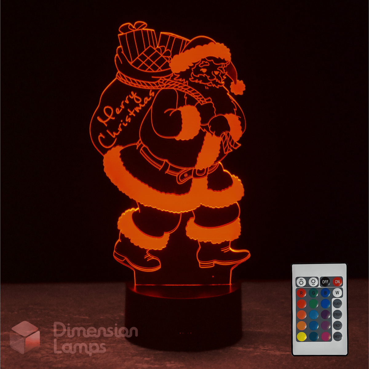 Santa Claus-shaped night light with remote control on a dark background