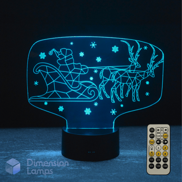 3D LED lamp with Santa Claus and reindeer design, featuring a remote control on a dark background.
