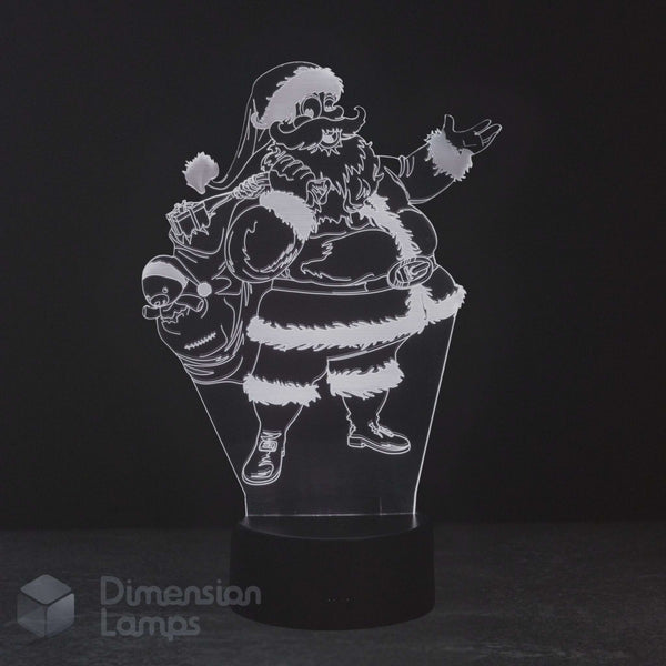 A 3D acrylic LED night light featuring a humorous, jolly Santa Claus character holding a skull sack, glowing white against a dark black background on a black base.