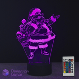 3D LED lamp with Santa Claus design and remote control on a dark background