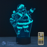 3D LED lamp with Santa Claus design and remote control on a dark background