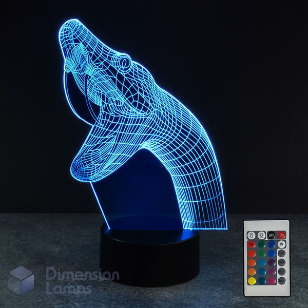 A 3D optical illusion lamp shaped like a snake, glowing cyan on a black base, shown with a small remote control and a visible 'Dimension Lamps' watermark on a dark background. Reptile lover gift idea. 
