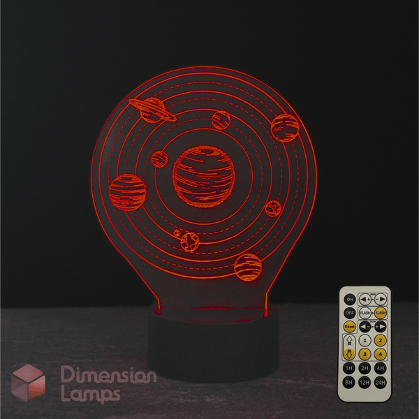 3D solar system lamp with remote control on a dark background