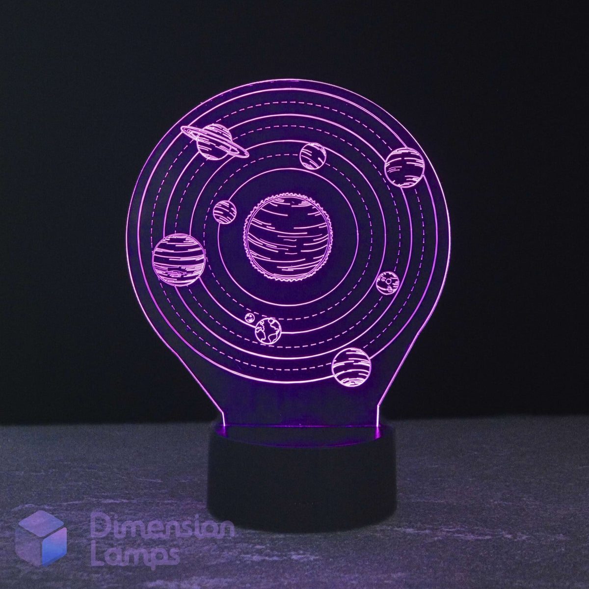 A 3D optical illusion night light shaped like the solar system, featuring glowing purple planets and rings on a black base, set against a dark background. Kids space themed gift night light.