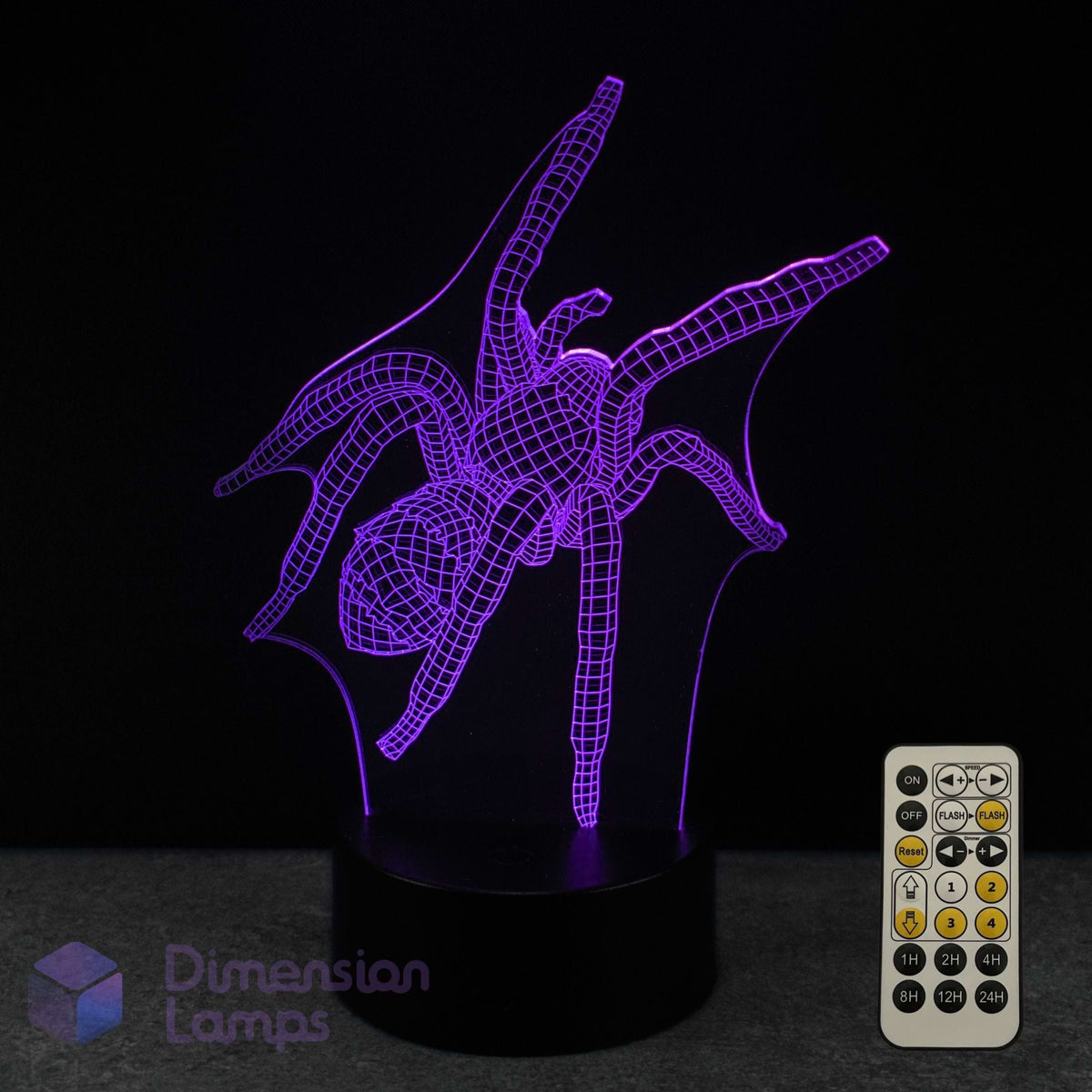 A 3D optical illusion LED night light shaped like a spider, glowing with purple light on a black base, shown with a 7 colour sleep timer remote control against a black background. A 'Dimension Lamps' logo is visible in the bottom-left corner.