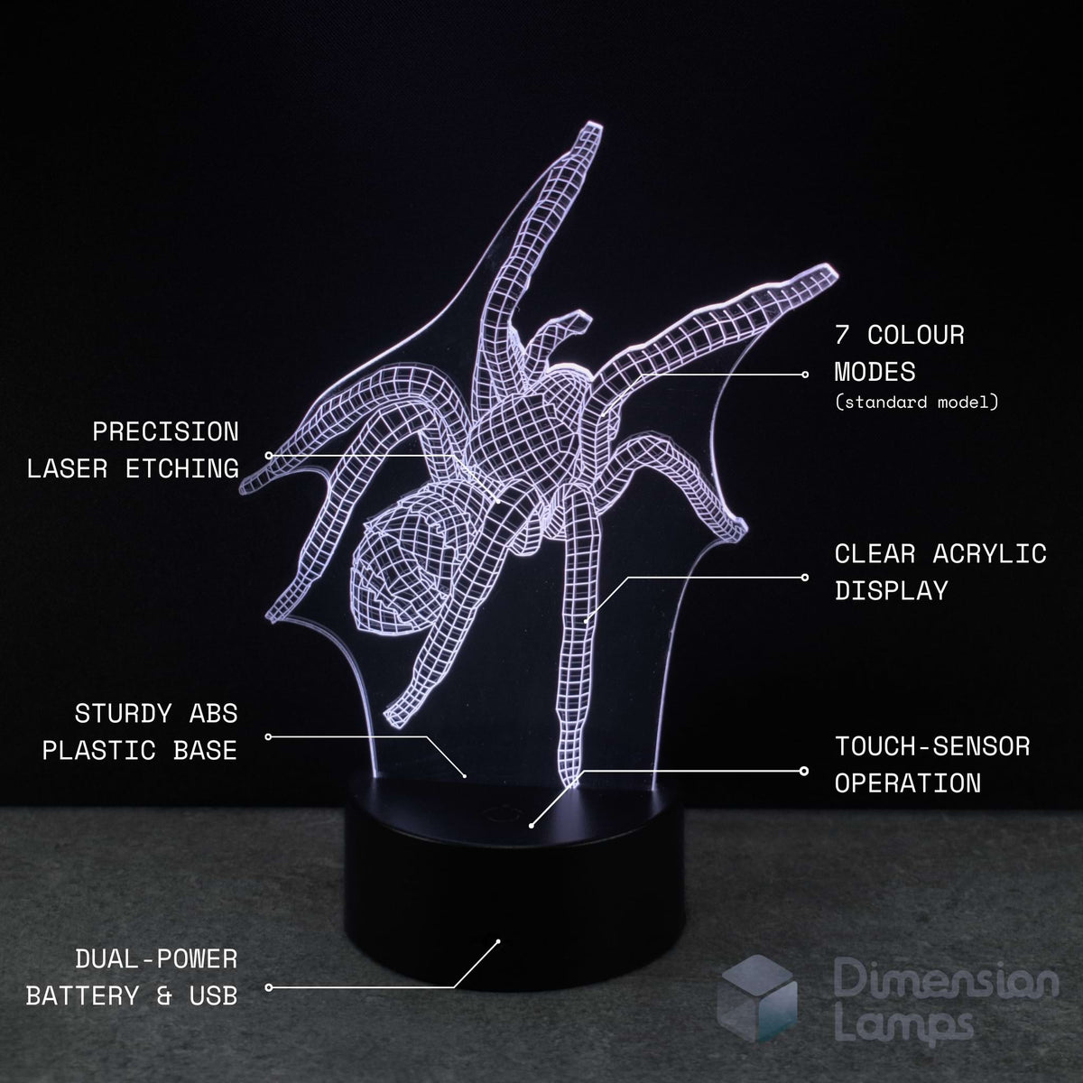 A 3D optical illusion spider night light with glowing white wireframe lines on a black acrylic stand, shown against a dark background with white text callouts detailing features like 7 colour modes, laser etching, and touch sensor operation. A Dimension Lamps logo is visible in the bottom right corner.