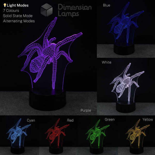 Spider-shaped 3D optical illusion LED night light on a black base, shown in multiple colour modes blue, white, purple, cyan, red, green, and yellow against a dark background. Teens spider themed gift idea. 