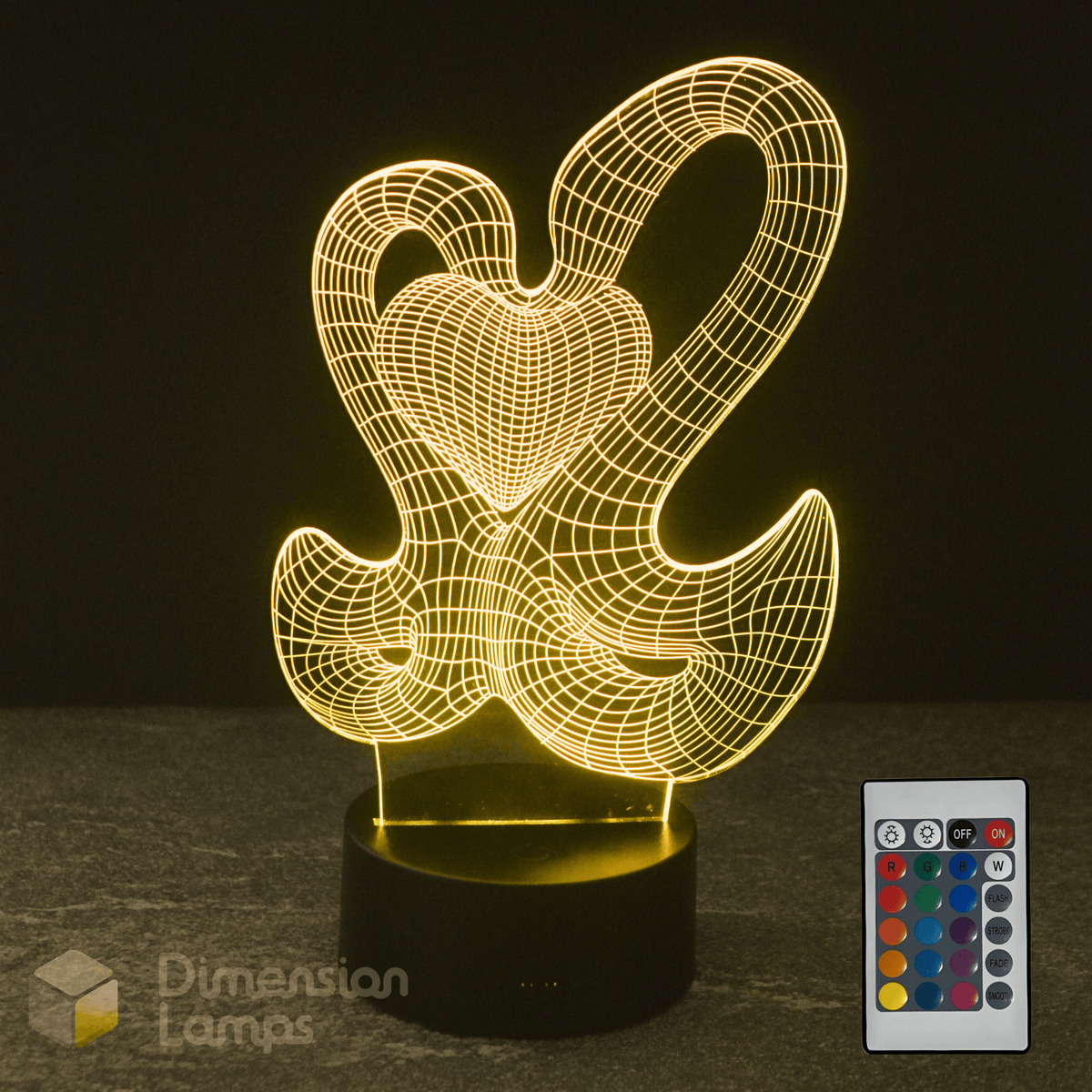 3D Swan and Heart lamp with a remote control on a dark background. Girls night light gift idea.