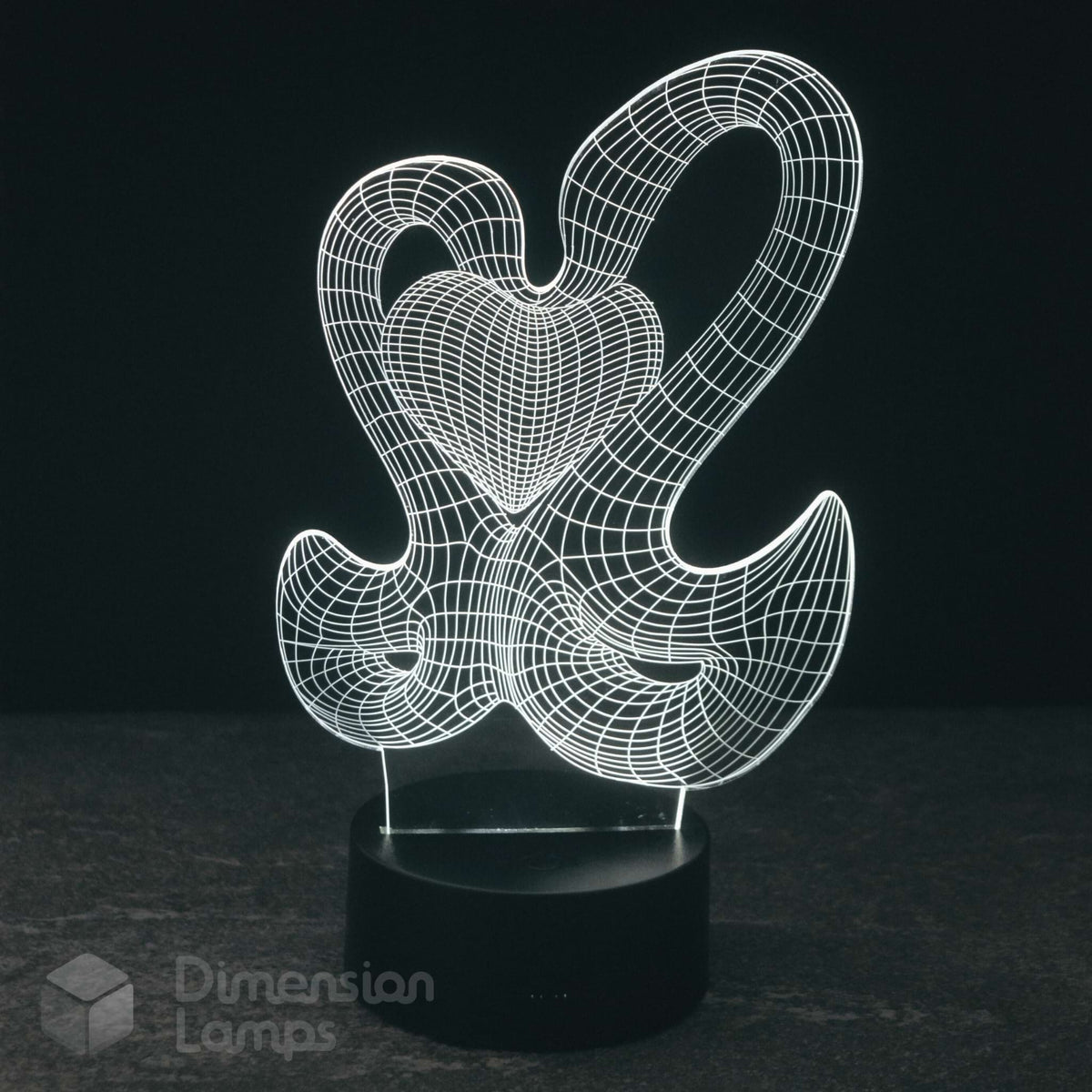A 3D optical illusion LED night light by Dimension Lamps, featuring 2 swans glowing white forming a wireframe heart against a dark background.