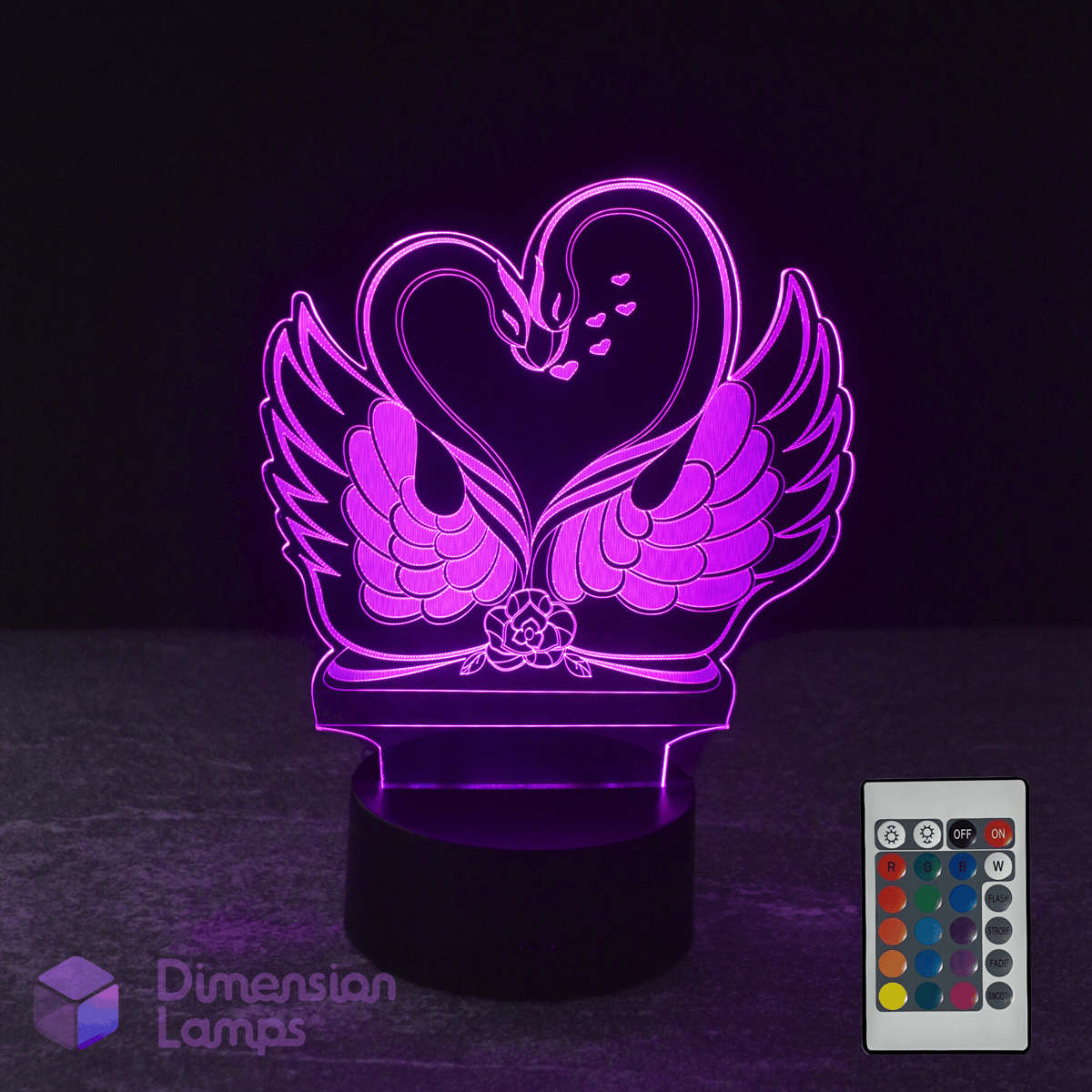 3D LED lamp shaped like a swan with a heart, accompanied by a remote control on a dark background.