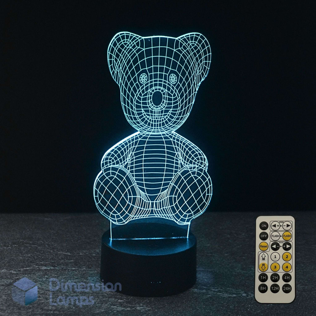 A 3D LED light of a teddy bear, glowing cyan wireframe on a black base, with a 7 colour remote control on a dark background and a Dimension Lamps logo