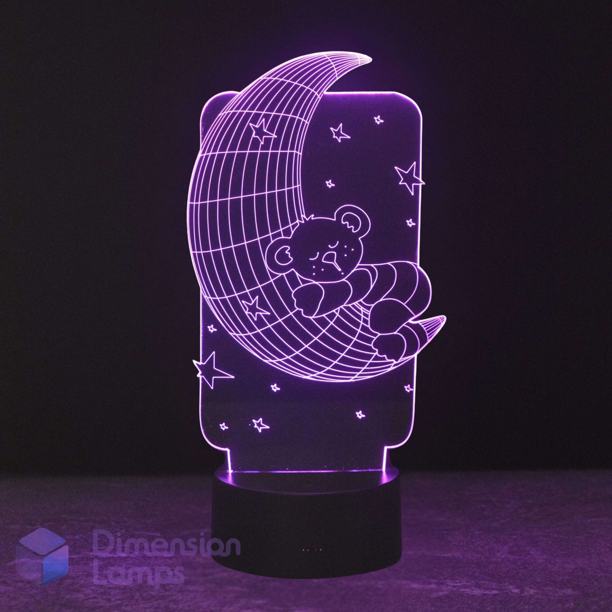 A 3D LED night light featuring a teddy bear sleeping on a crescent moon with stars, glowing purple on a black base. Calming night light for kids. 
