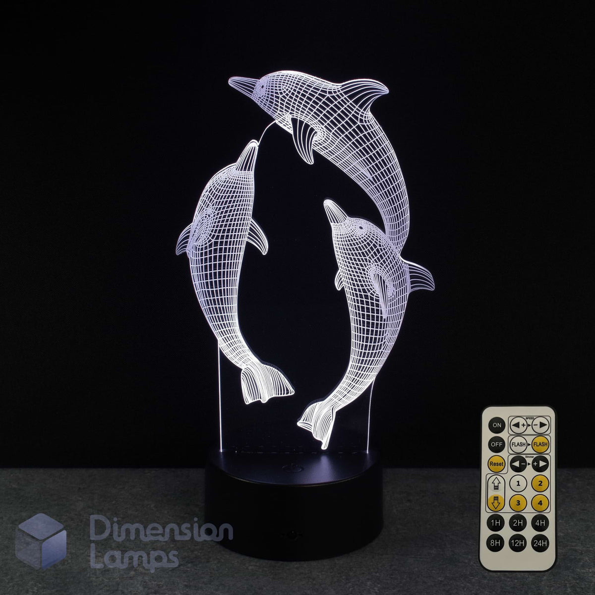 3D LED lamp with dolphins design and remote control on a black background