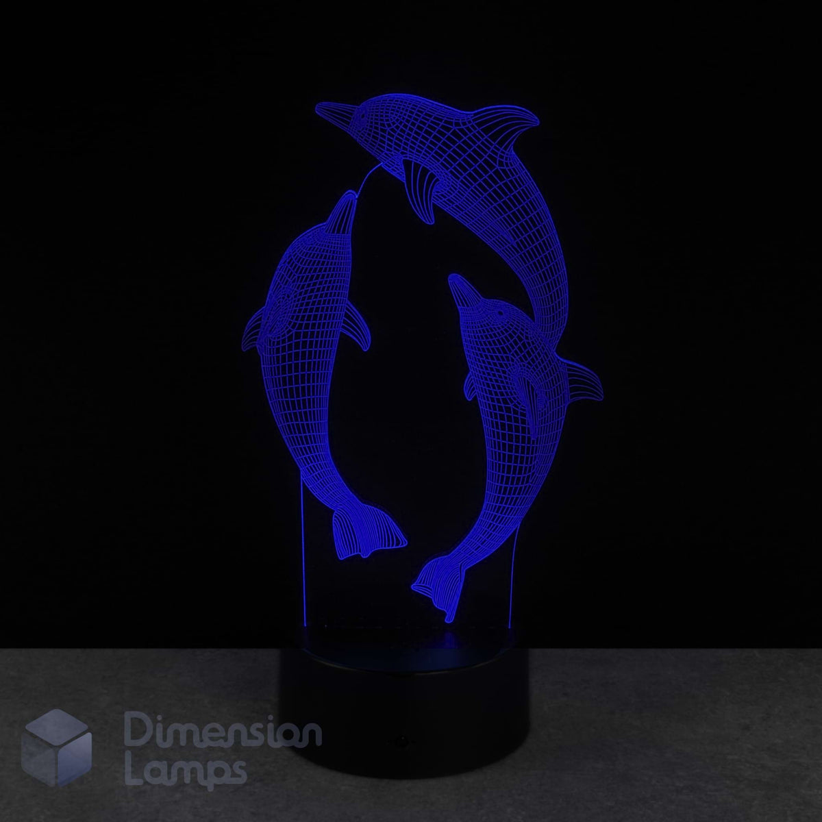 3D dolphin lamp with blue light on a black background. Marine life gift idea.