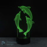 3D LED lamp with dolphins design on a black background. Girls night light.