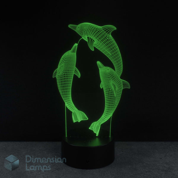 3D LED lamp with dolphins design on a black background. Girls night light.