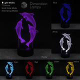 3D dolphin lamp with colour-changing options on a dark background. Girls gift idea