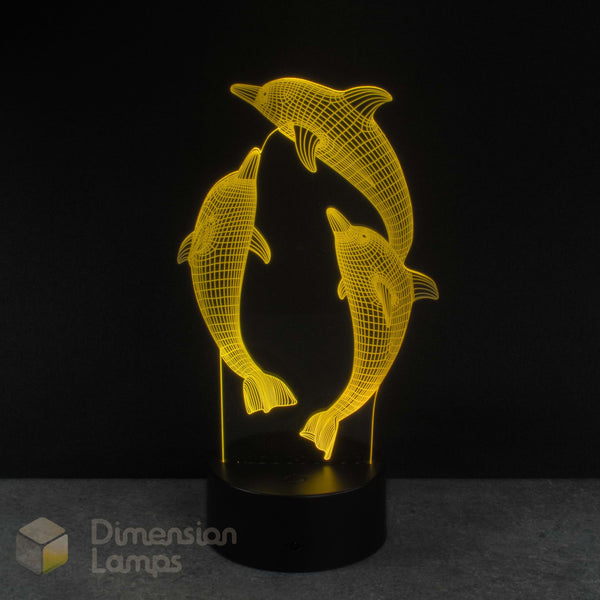 3D LED lamp with dolphin design on a black background. Kids night light idea.
