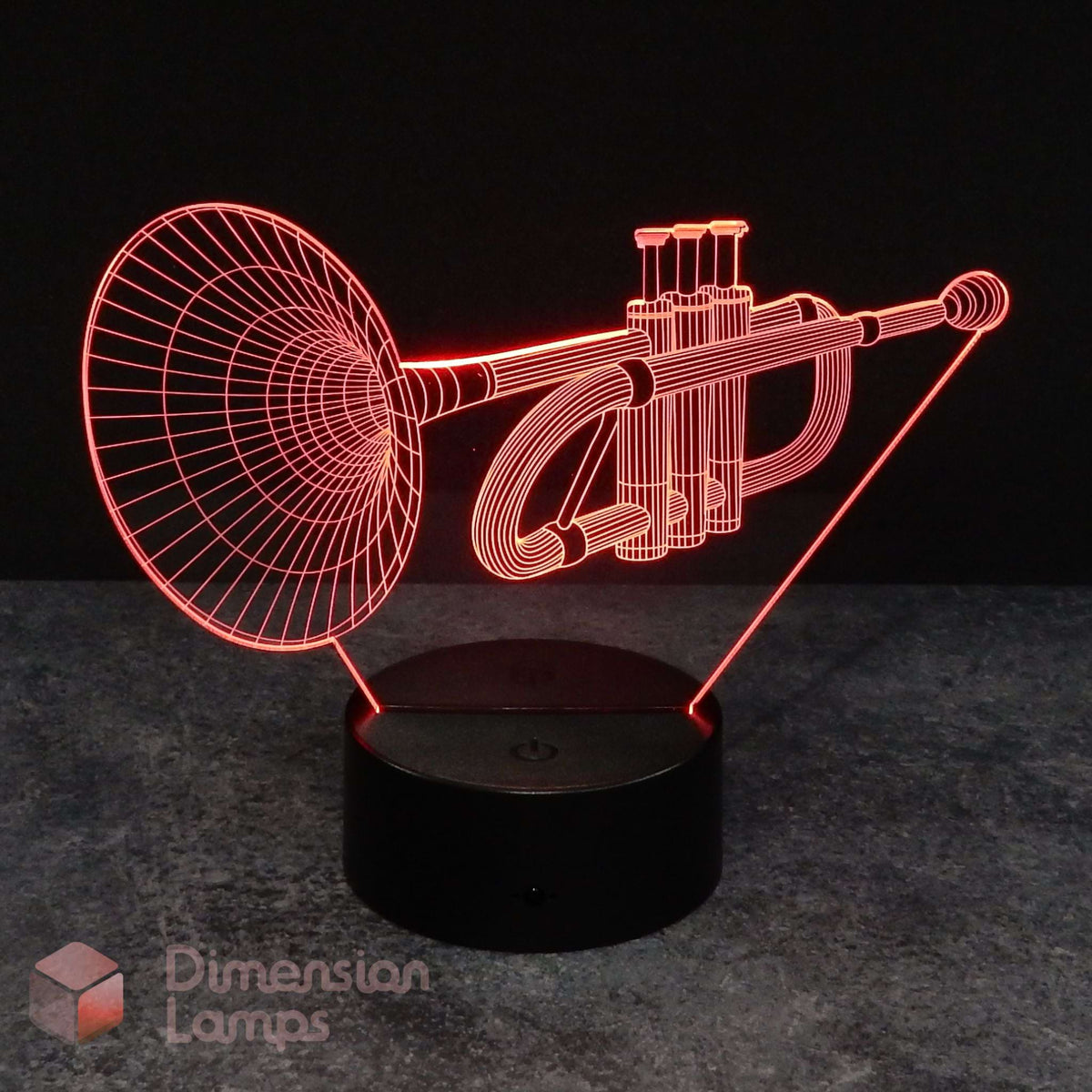 A Trumpet 3D acrylic illusion lamp glowing red on a black base against a black background. Dimension Lamps logo is visible in the bottom-left corner.