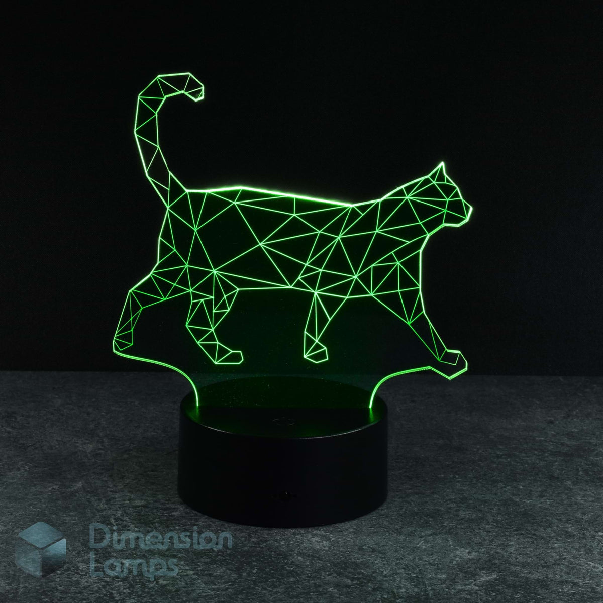 A 3D optical illusion LED night light shaped like a walking cat, glowing with a bright green geometric line pattern on a black cylindrical base, set against a dark background. Thoughtful gift for cat lovers.
