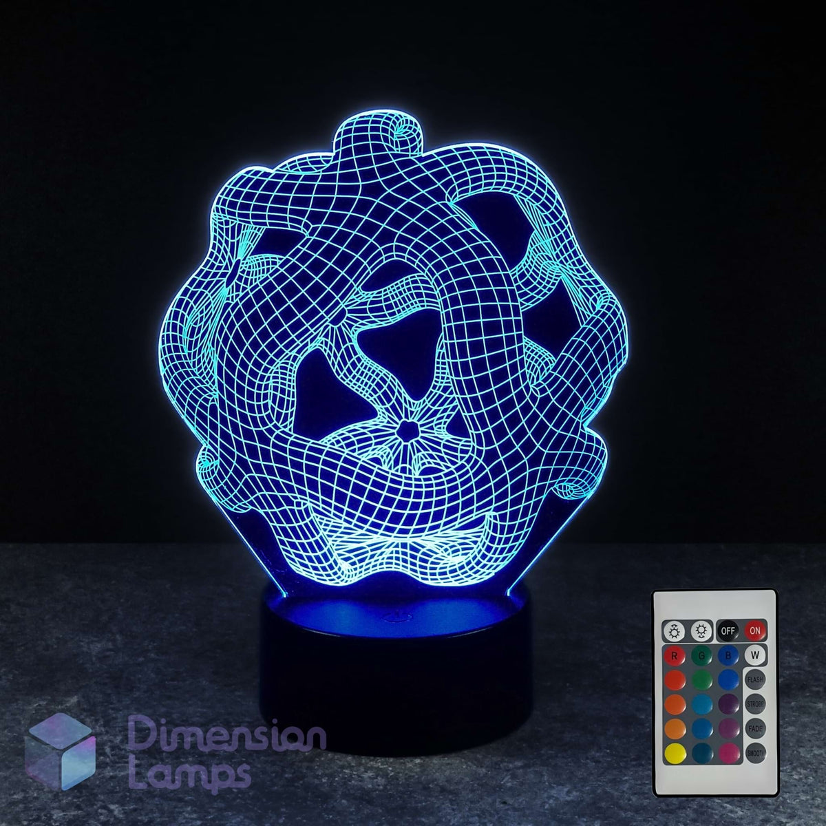 A 3D optical illusion lamp with a cyan wireframe warped space design on a black base, shown alongside its 16 colour remote control against a dark background.