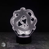 A 3D optical illusion LED night light with an intricate, glowing white wireframe knot design on a black cylindrical base, set against a dark background.