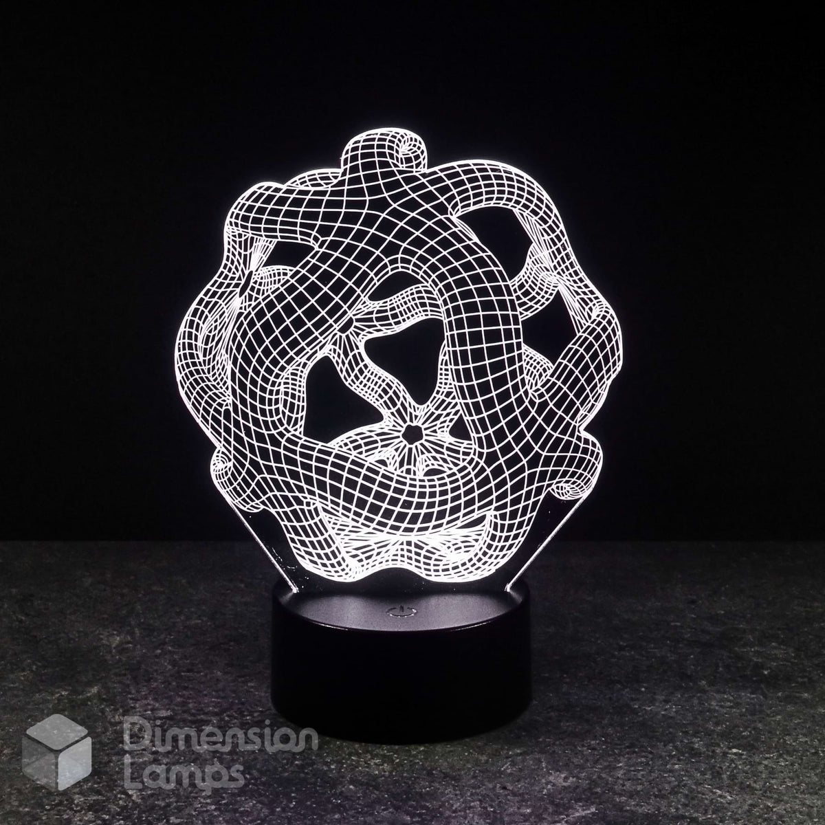 A 3D optical illusion LED night light with an intricate, glowing white wireframe knot design on a black cylindrical base, set against a dark background.