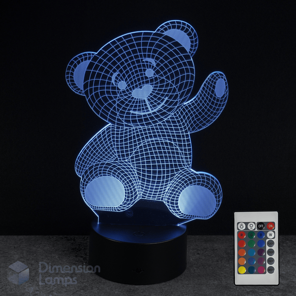 3D teddy bear lamp with remote control on a dark background. Baby shower gift idea.